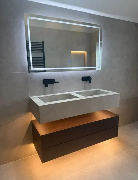 Bathroom with a backlit LED mirror and an underlit floating vanity, electrical work in Warrington