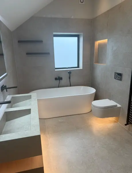 Bathroom with a freestanding bath and LED niche lighting