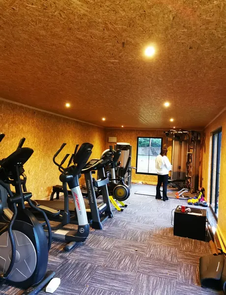 Home gym in a garden room with ceiling downlights